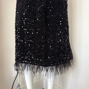 Sparkly black sequin skirt with feathers